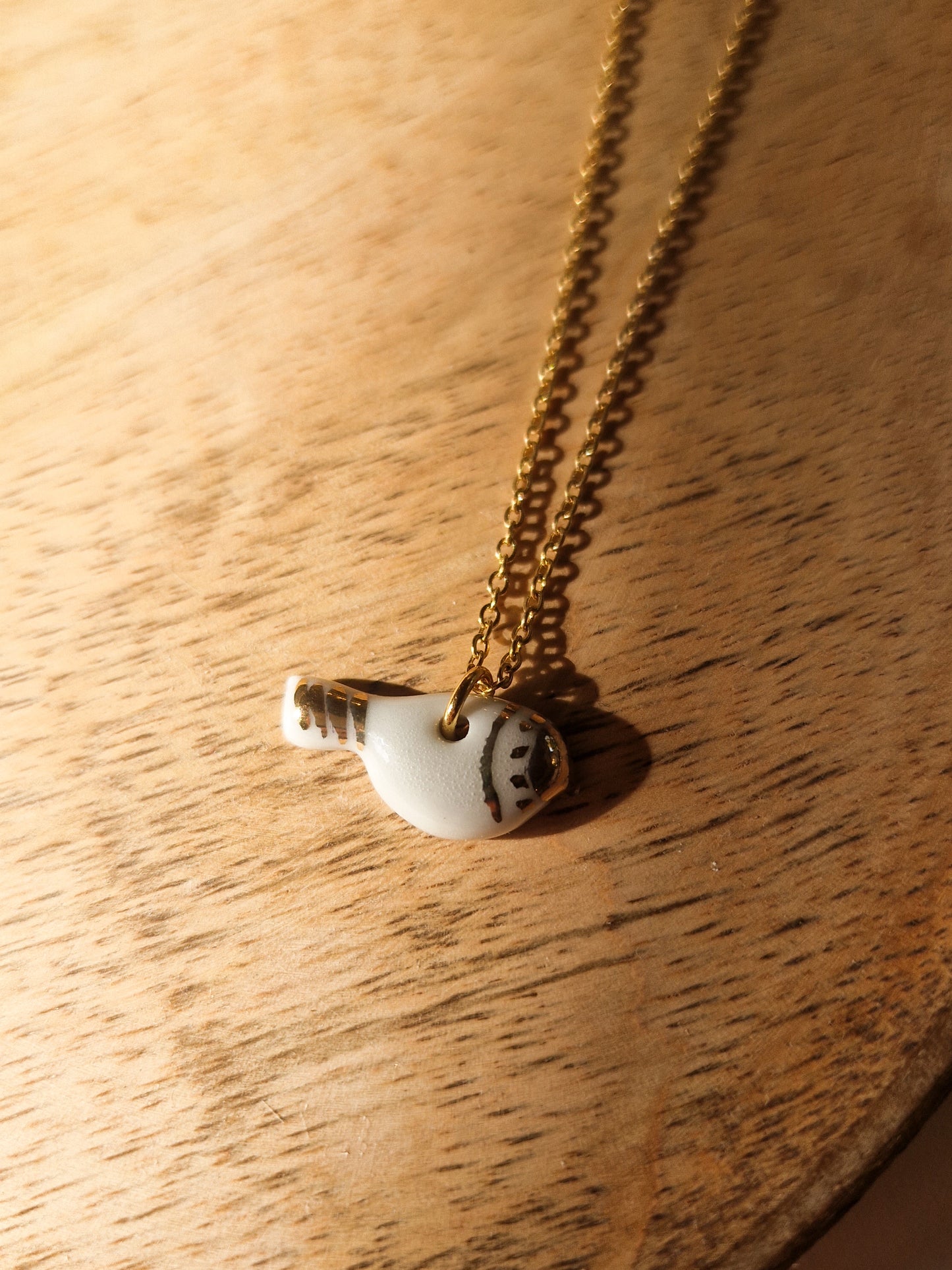 Collier Oiseau en porcelaine